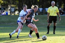 Mid Coast's Beth Kataur playing in a premier league clash at Taree Zone Field this year. The side is scheduled to meet New Lambton in Newcastle this weekend.