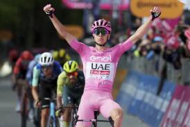 Tadej Pogacar celebrates his third win of the Giro d'Italia with Aussie Ben O'Connor (L) in third. (AP PHOTO)