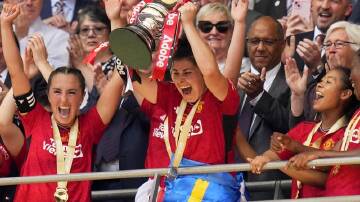 Manchester United's Lucia Garcia lifts the Women's FA Cup at Wembley after they beat Spurs 4-0. (AP PHOTO)