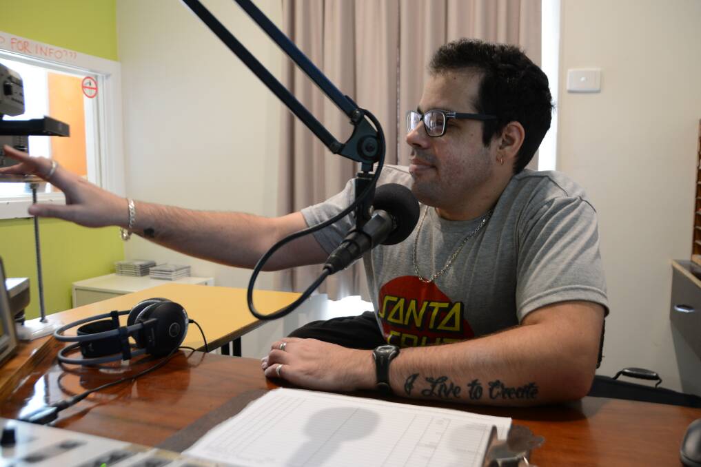 Mat Early in the radio studio at 2BOB where he presents a rock show twice a week. Mat was born with Spina Bifida and uses a wheelchair. He would like to move out of his parent's home, but has found it difficult to find an affordable option which meets his needs.