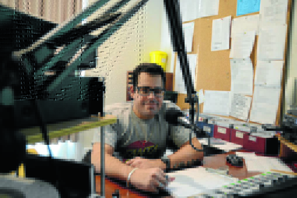 Mat Earley in the radio studio at 2BOB where he presents a rock show twice a week. Mat was born with spina bifida and uses a wheelchair. He would like to move out of his parent's home, but has found it difficult to find an affordable rental option which meets his needs.