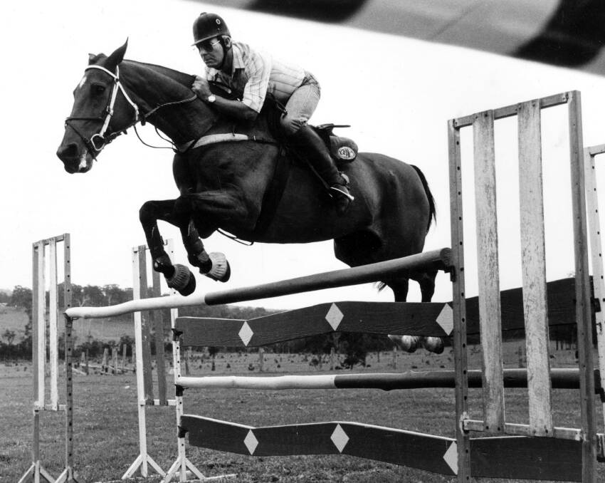 All the way with John Fahey: Equestrian great Johnny Fahey clears a jump during a training ride in his prime.