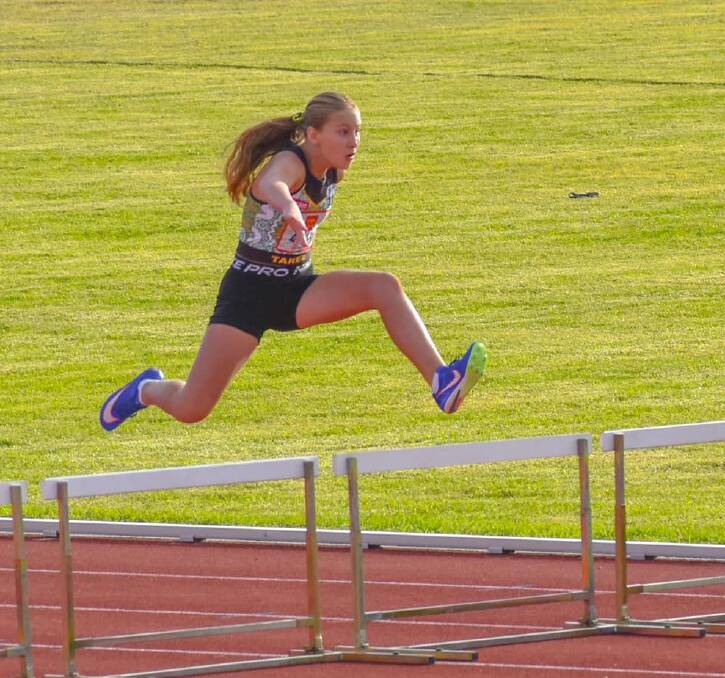 Jarrah Butler on the way to setting a new regional record in the under 11 girls 80 metre hurdles. Jarrah had a strong meet and was a multiple medal winner.