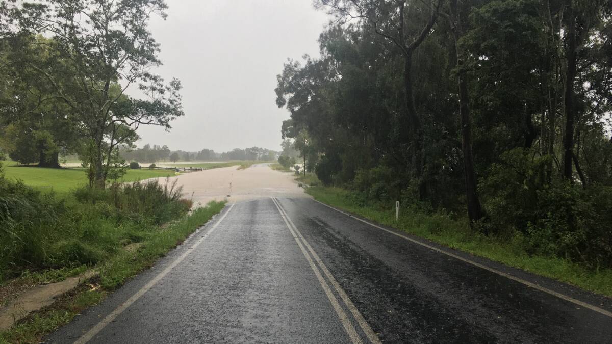Rodeo Dr at Macksville, inundated by the swollen Nambucca River