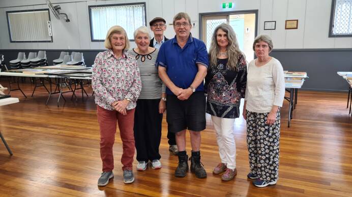 Volunteers getting ready to hang paintings for the 2024 Lansdowne Community Hall Art Show - Helen O'Connor, Gai Mayers, Brian Mavin (back), Greg Burns, Louise Green and Sue Mavin. Picture supplied.