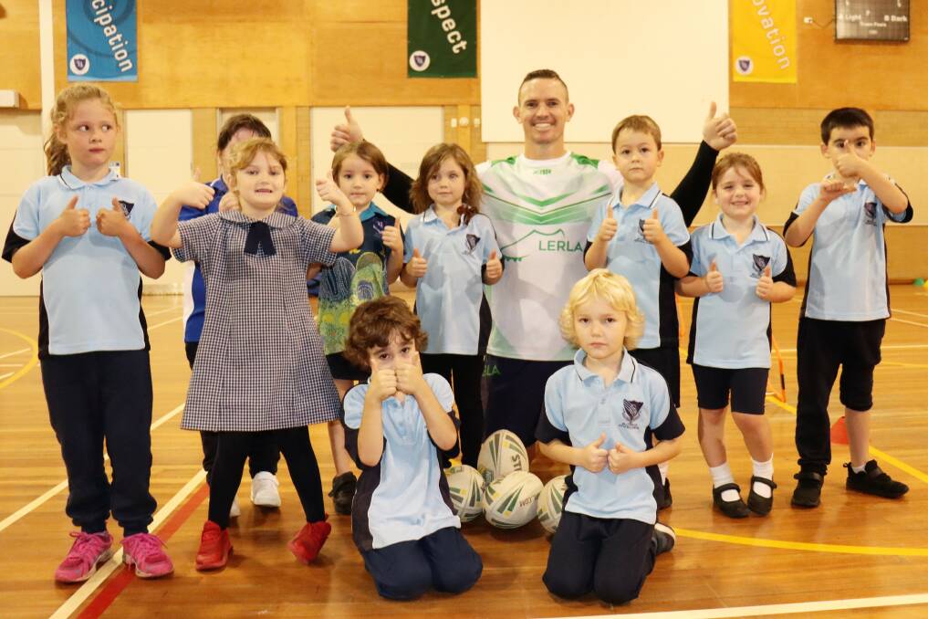 Tim Browne has returned to his alma mater for term two sharing his rrugby league skills with primary and secondary school students.