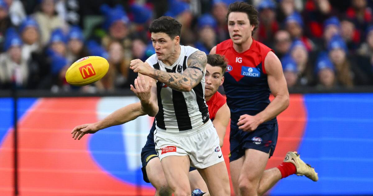 Jack Crisp handballs in Collingwood and Melbourne's clash earlier this year. The two teams play again on Thursday night. Picture by Getty Images