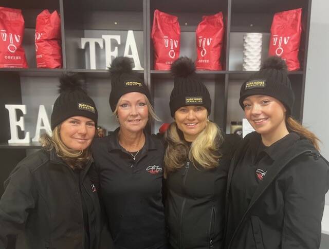 Nerida and staff at Cafe Thyme modelling the 2023 MHF Beanies for Brain Cancer. Picture supplied