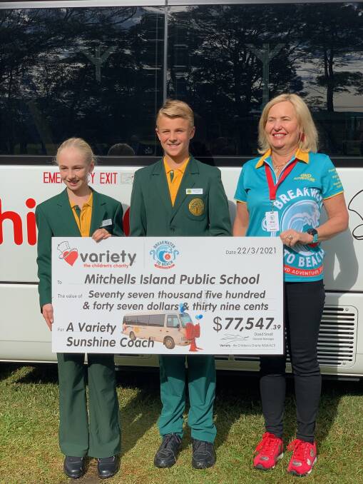 Mitchells Island school captains, Denver Purdon and Emily Boere, with Sharon White, the highest fundraiser on our 4WD Adventure. Photo supplied