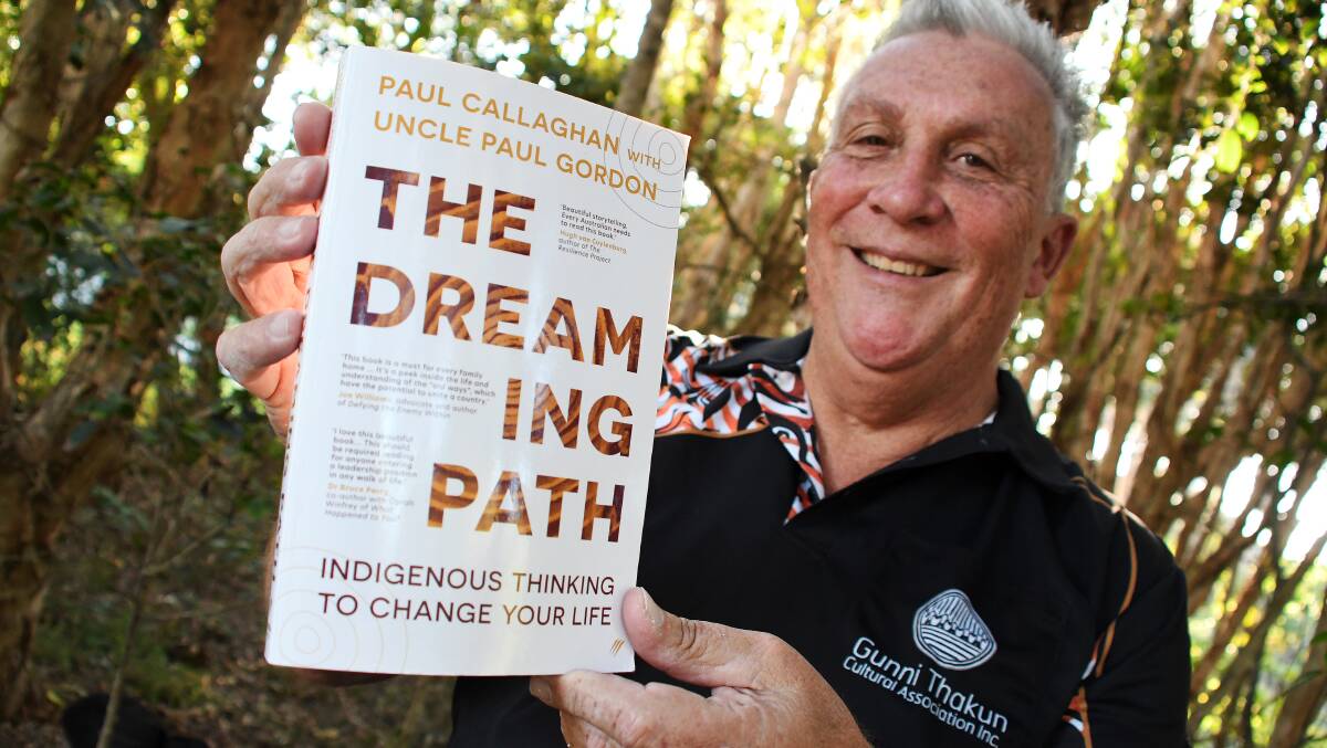 Worimi author Paul Callaghan with his prize-winning book. Picture by Scott Calvin