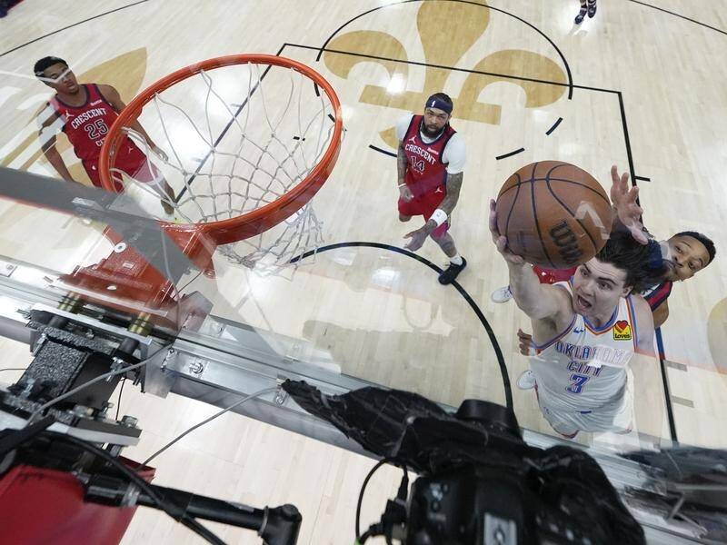 Josh Giddey goes to the basket during the Thunder's 21-point playoffs win over New Orleans. (AP PHOTO)